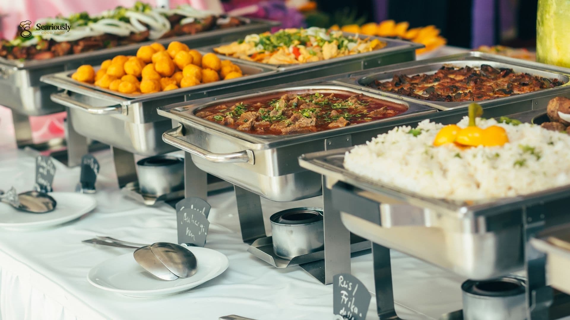 Buffet line of hot dishes at a Sacramento catered party